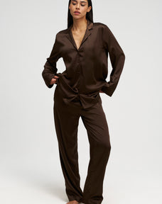 Woman wearing silk PJ in brown, front shot image 2.
