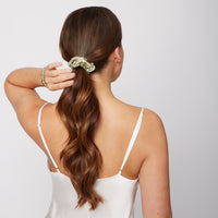 Woman wearing a Silk Large Scrunchie in Olive Green