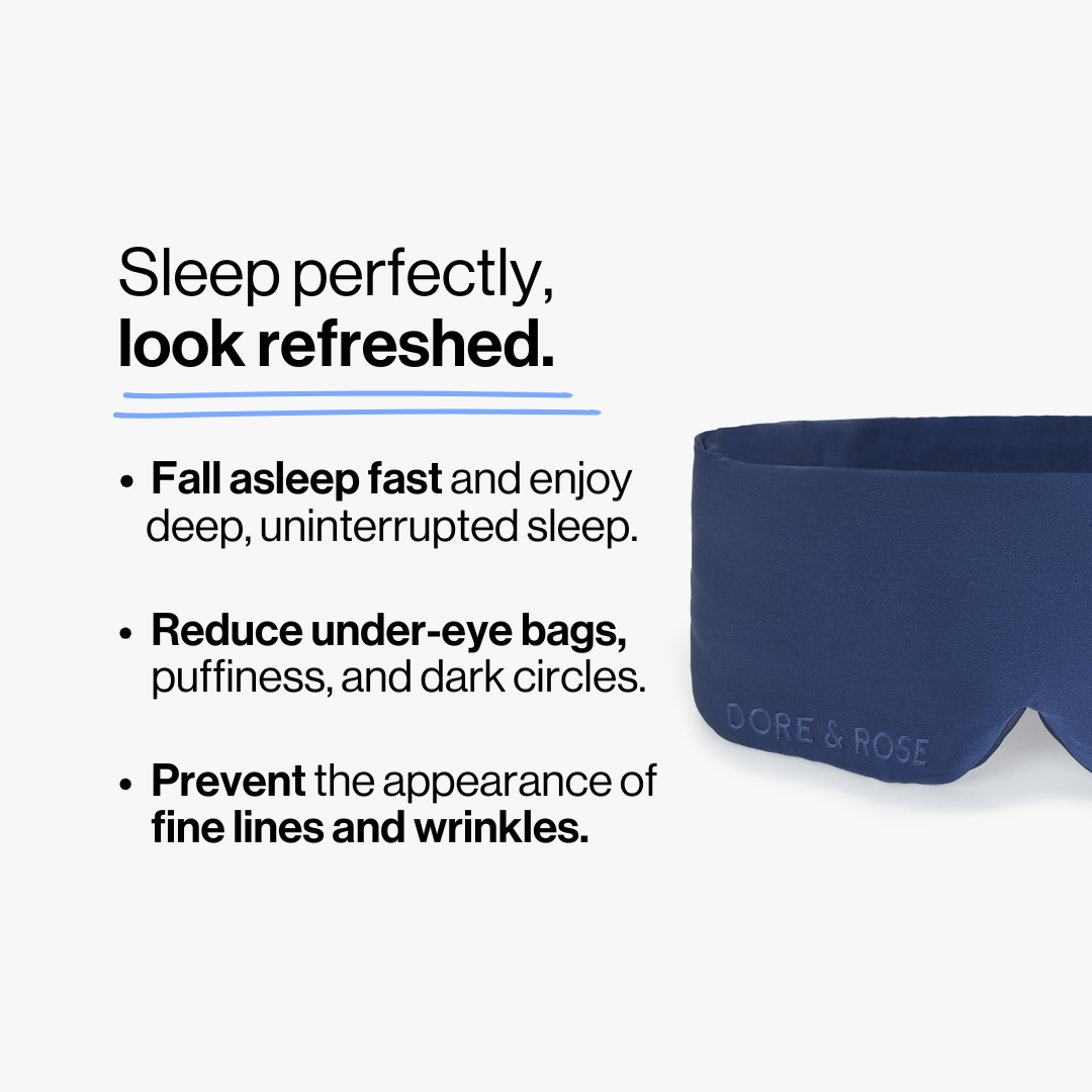 Half photo shot of Dore and Rose Luxury Soft Silk Sleeping Eye Mask in the color navy blue with its benefits listed beside it