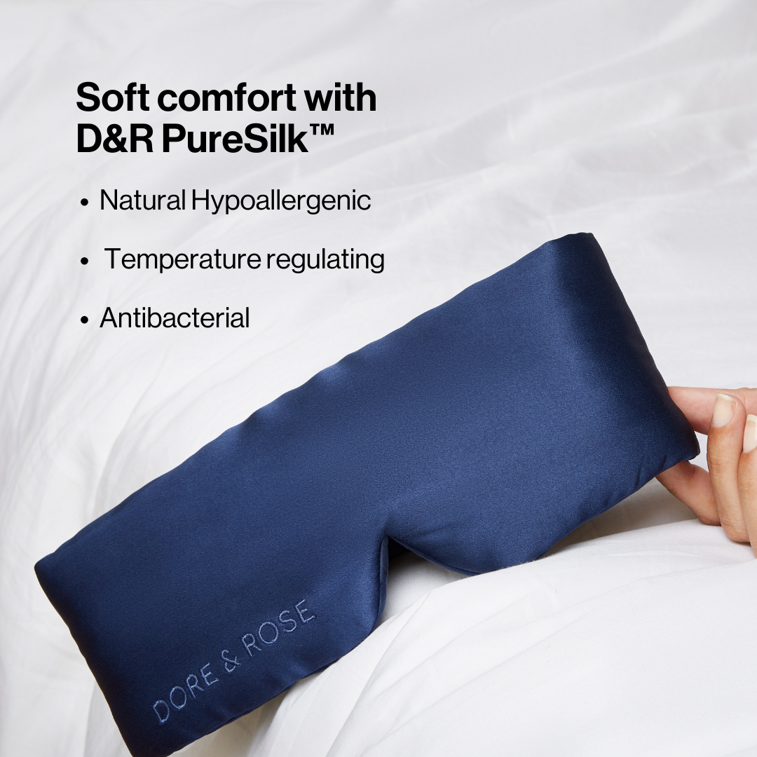 Dore and Rose Luxury Soft Silk Sleeping Eye Mask in the color navy blue with its benefits listed beside it