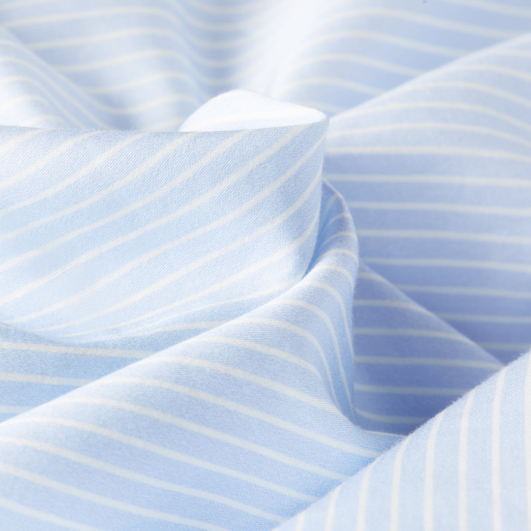 A closer look on the texture and material of the soft silk bedding from Dore and Rose in Blue and White stripes