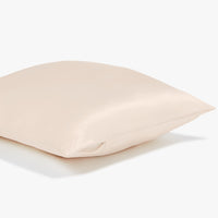 Side view of a beige pillowcase showing the sturdy zipper on the side of the pillowcase