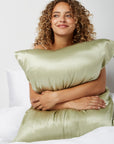 Woman hugging a Silk Green pillow