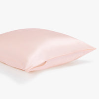 Side view of a pink pillowcase with zipper