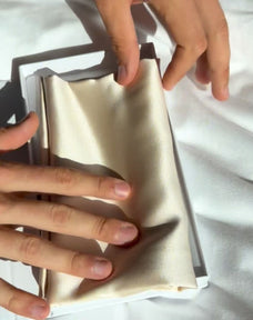 Unboxing video of the Dore and Rose Luxury Soft Silk Pillowcase  in the color Champagne Beige