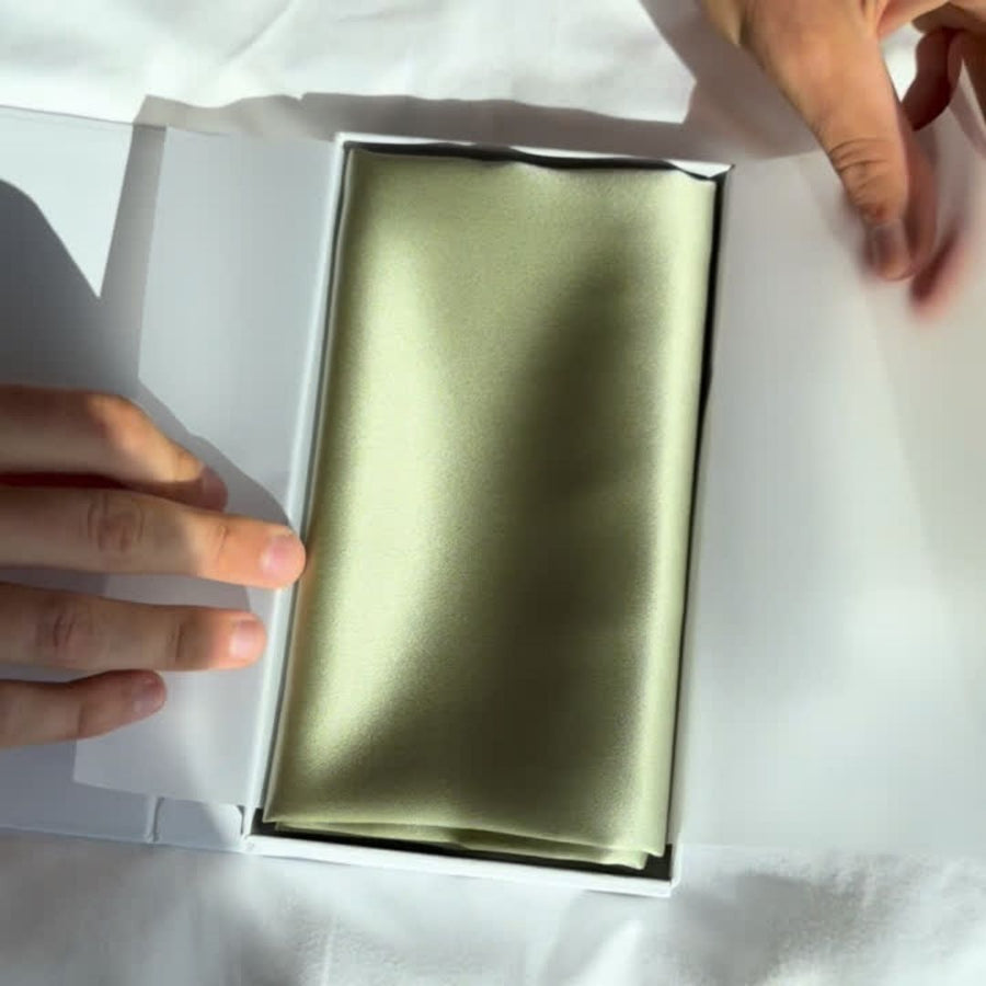 Unboxing video of the Dore and Rose Luxury Soft Silk Pillowcase  in the color Olive Green