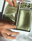 Unboxing video of the Dore and Rose Luxury Soft Silk Pillowcase  in the color Olive Green